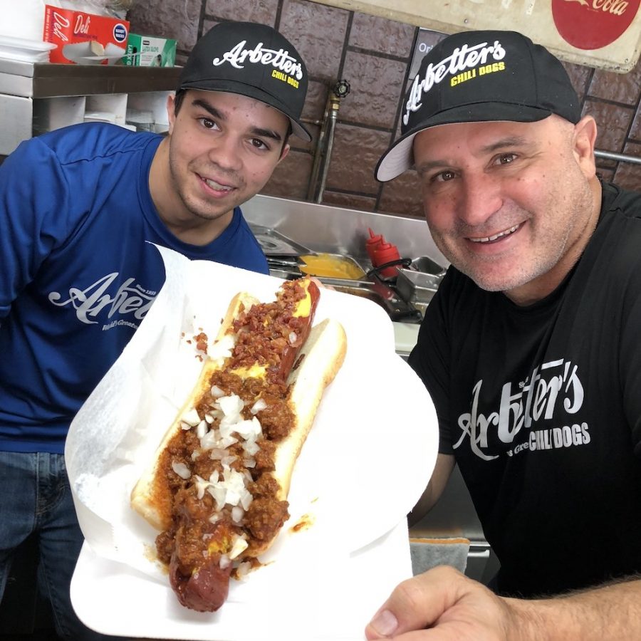 Arbetter's employee Arnold and owner David Arbetter with a Monster Chili Beef Dog