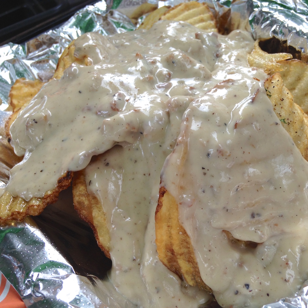 Chips with Sausage Gravy from BurgerQue in Fort Myers, Florida