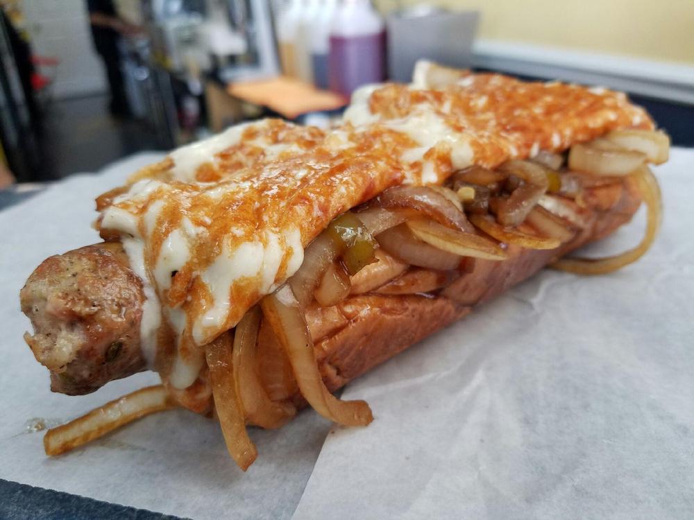 Italian Sausage topped with Grilled Onions & Griddled Mozzarella Cheese from Sweet Dogs in Miami, Florida