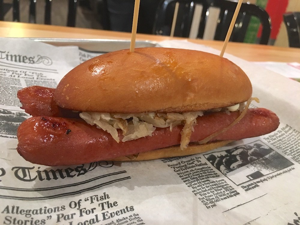 MOOYAH New York Dog topped with Kraut, Onions, and Mayo