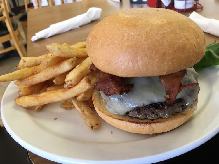 Horseradish & Cheddar Bacon Burger with Fries from Red Rooster in Marco Island, Florida