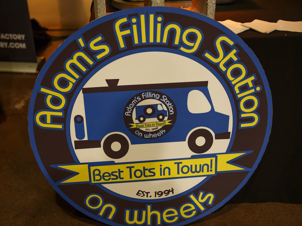 Adam's Filling Station on Wheels Sign