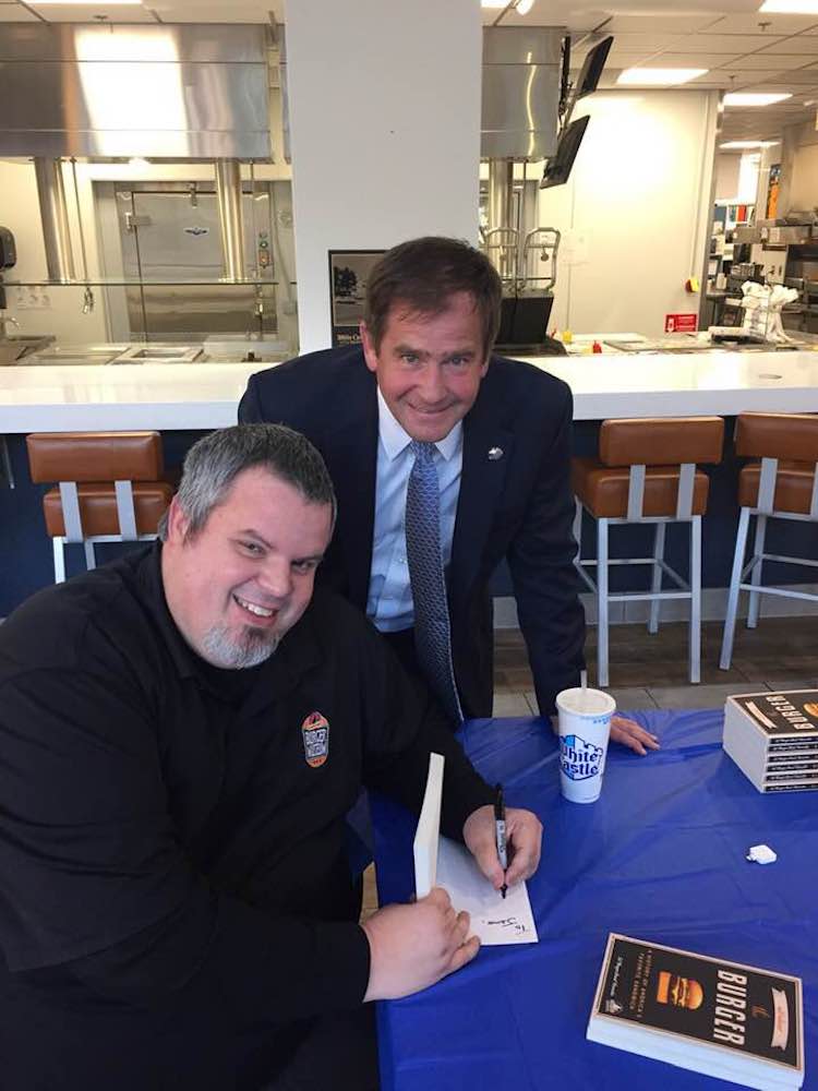 Burger Beast signing White Castle Vice President Jamie Richardson's book
