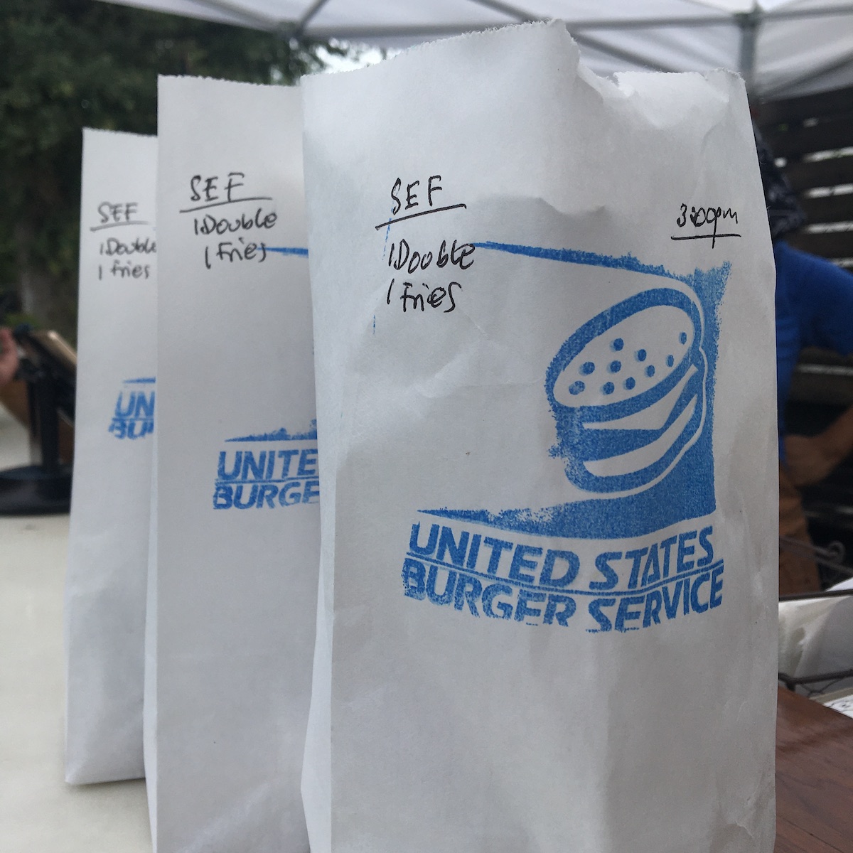 Bags of Burgers from USBS at the Citadel Food Hall in Miami, Florida