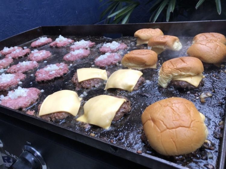 Smash Burgers cooking on a Blackstone Grill