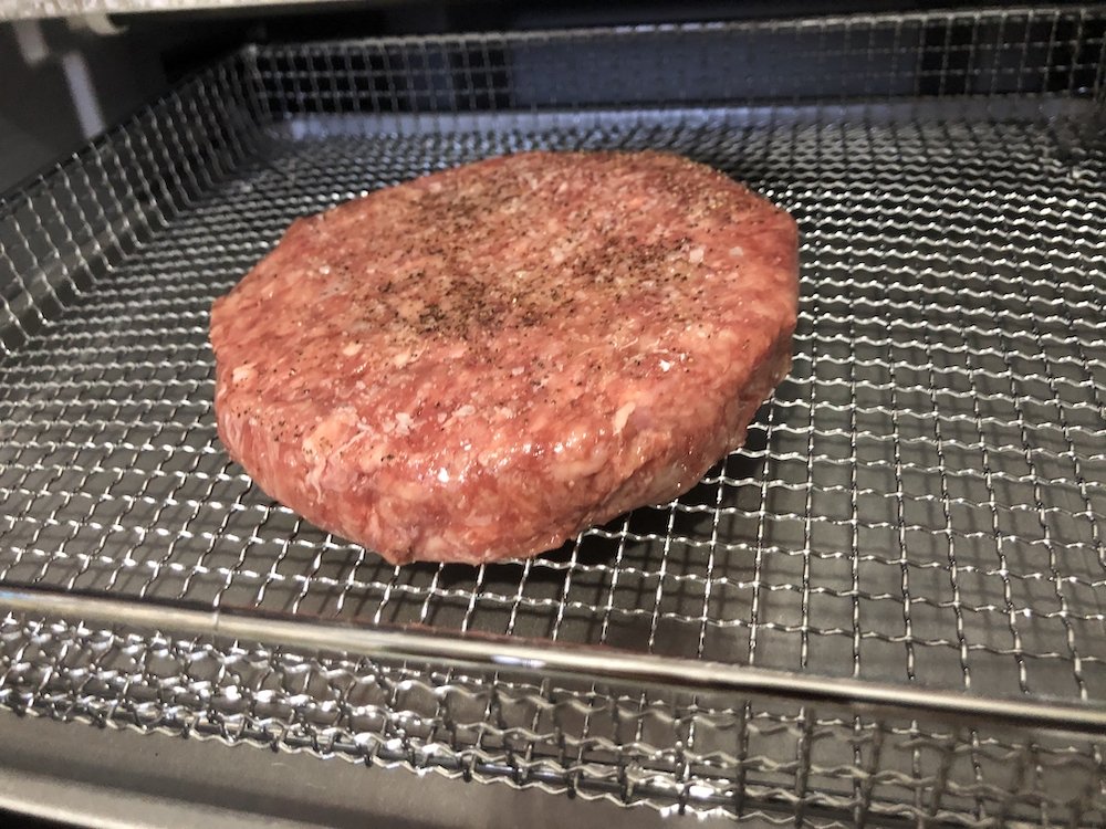 Place Seasoned Burger Patty in Air Fryer