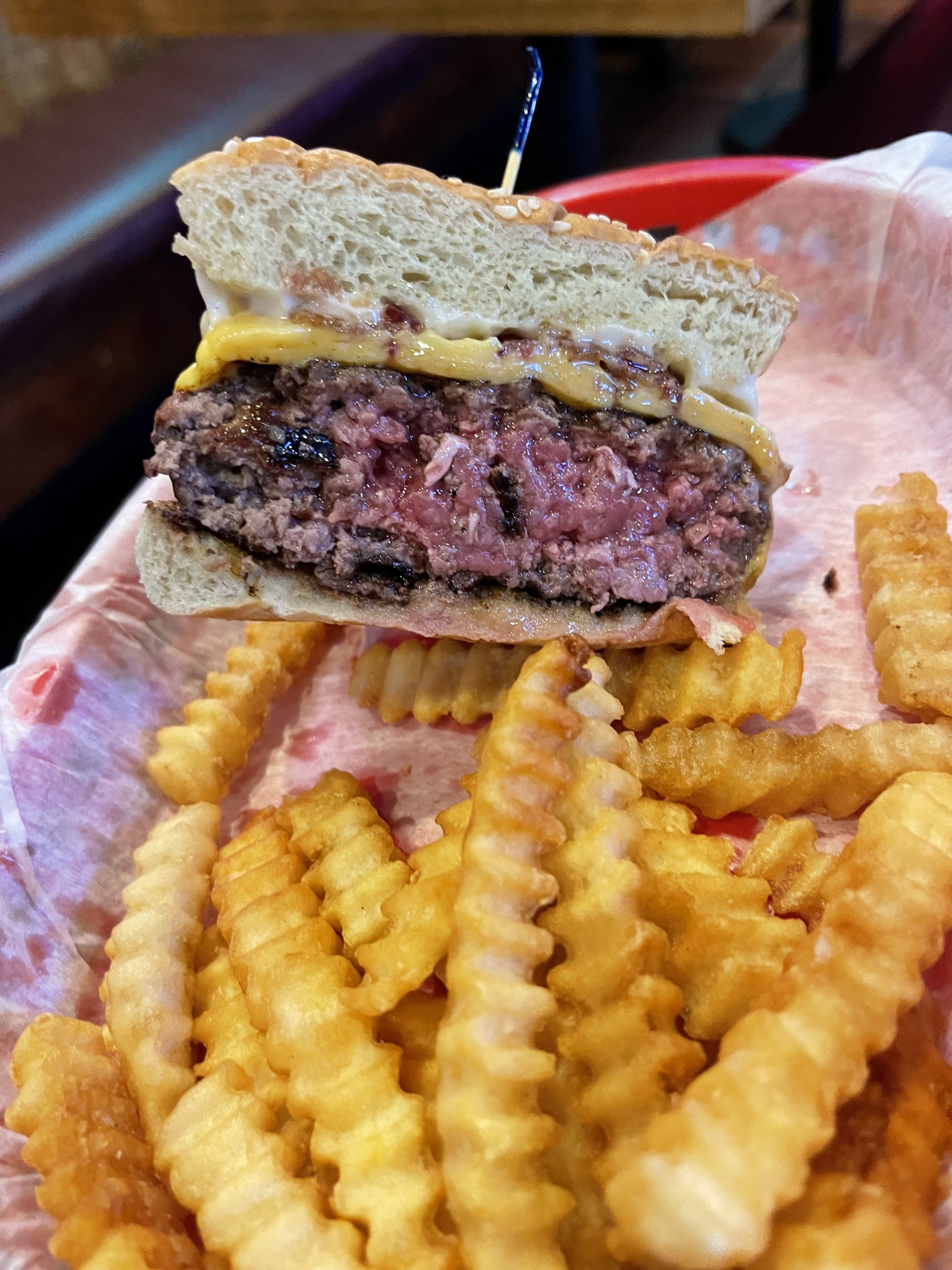 Brass Ring Pub 1/2 lb. Cheeseburger Half (cooked Med-Rare) & Fries in North Palm Beach, Florida