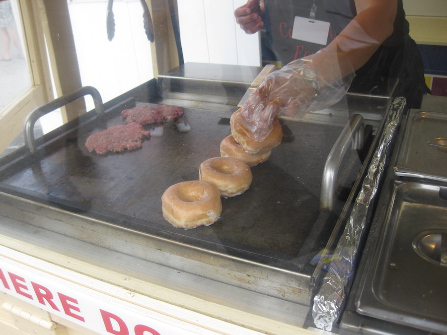 Adding the Donuts to the griddle for the Luther Burger