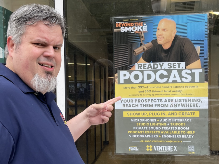 Burger Beast points at the Beyond the Smoke Podcast Poster featuring Thomas Ward