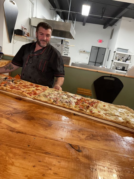 Nic & his 6 foot pizza from Nic's New York Pizza in North Miami, Florida