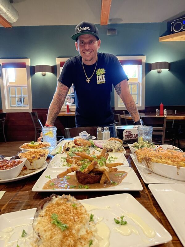 Chef Bobby Marcotte with his creations at The Tuckaway Tavern & Butchery in Raymond, New Hampshire