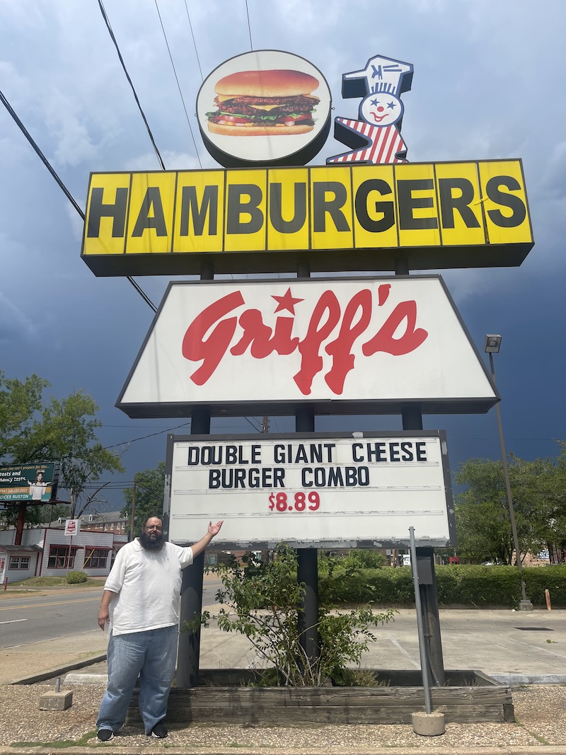 Fred standing next to the Griff's Hamburgers sign in Ruston, Louisiana