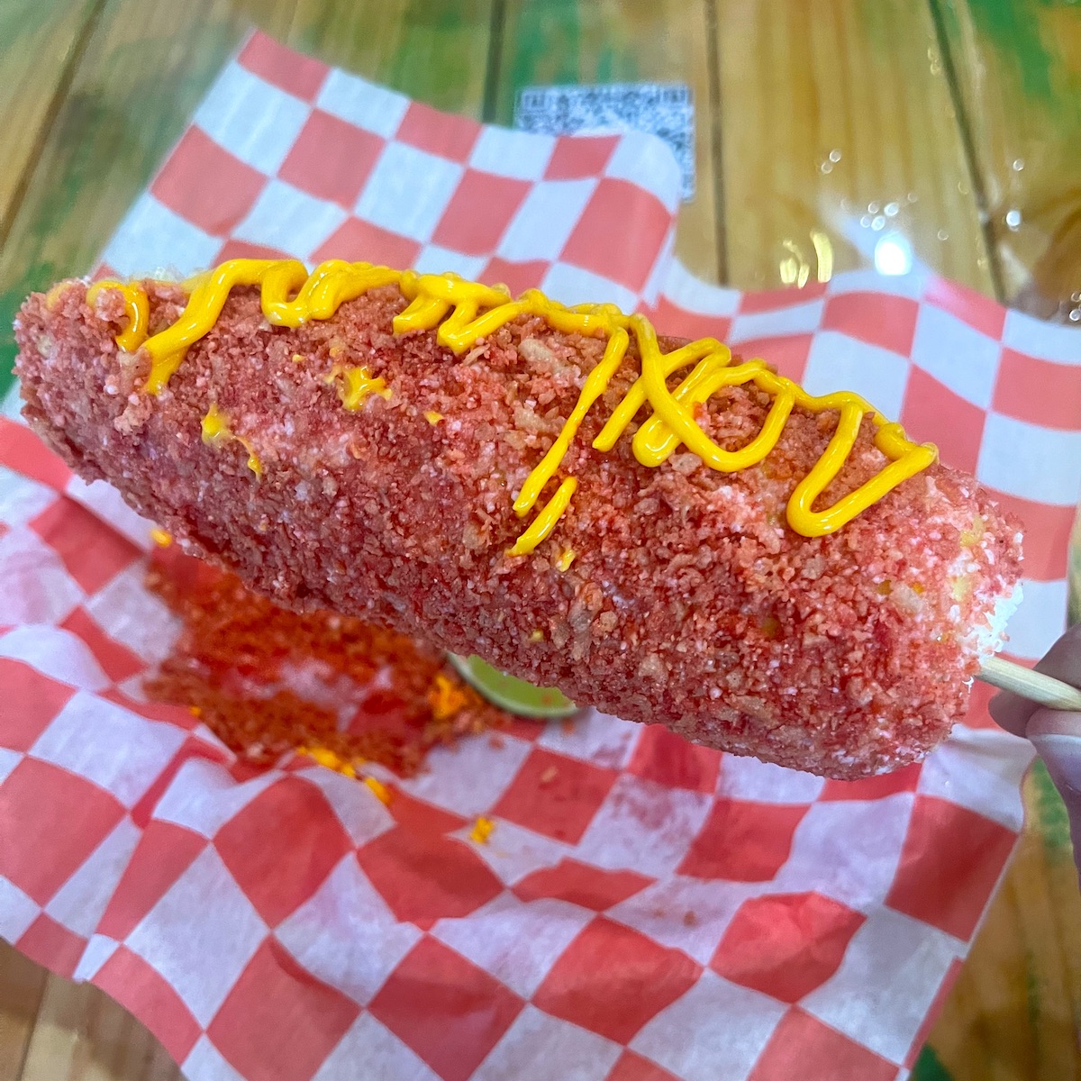 Elote covered in Takis from No Manches Taqueria in West Miami, Florida