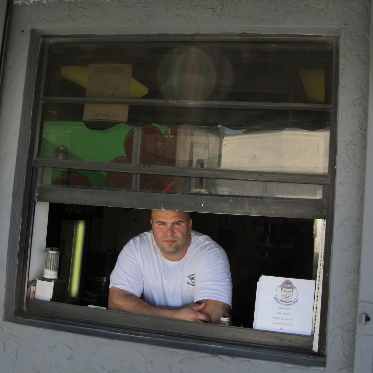 Fireman Derek in the window at his original commissary in Wynwood