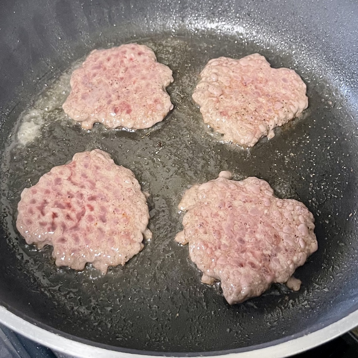 Holten's Chop House Smashed Sliders Cooking in the Pan