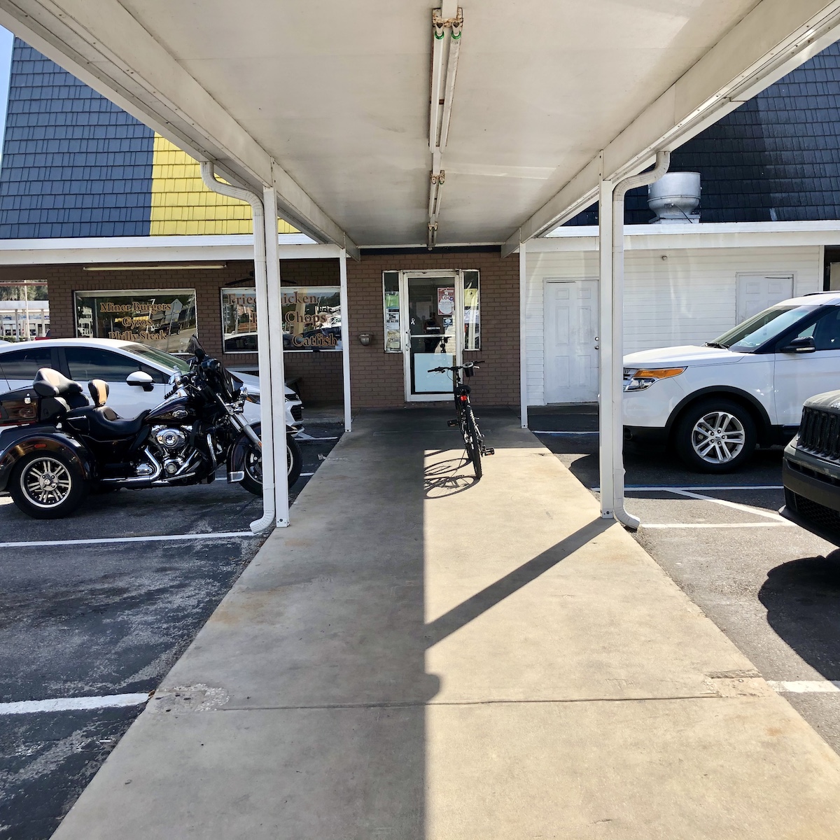 Car Parking Area and Curb Service Parking at John's Drive In in Fort Meade, Florida